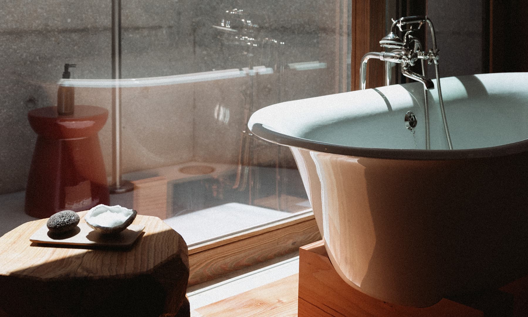 <p>A large bathroom with free standing bathtub, a walk-in shower, and an outdoor shower makes up one of the most beautiful spaces of our Dune Pool Houses.</p>